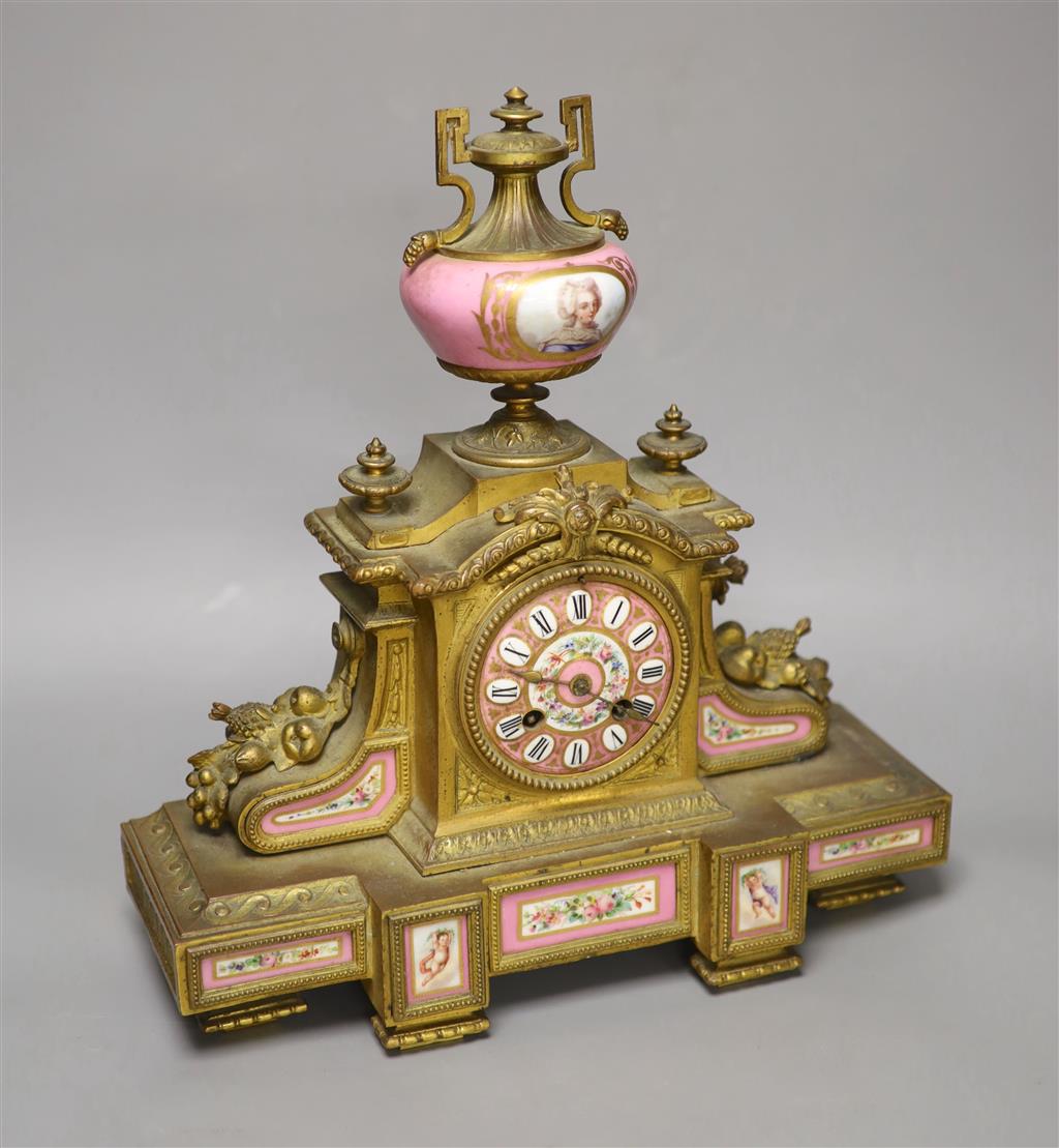 A 19th century French gilt metal and porcelain inset mantel clock, height 37cm